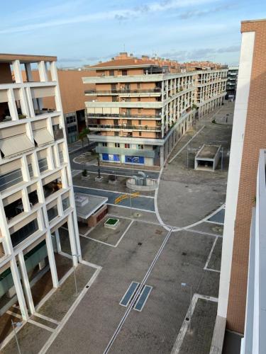 an aerial view of a parking lot with buildings at AGM Suite Rome Airport FCO - Attico Parco Leonardo in Fiumicino