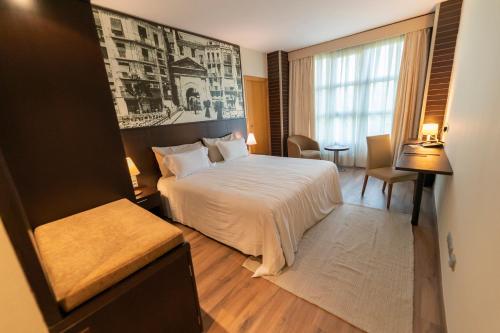 Postel nebo postele na pokoji v ubytování Nastasi Hotel & Spa