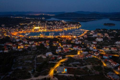 an aerial view of a city at night at Villa Millennium in Jezera