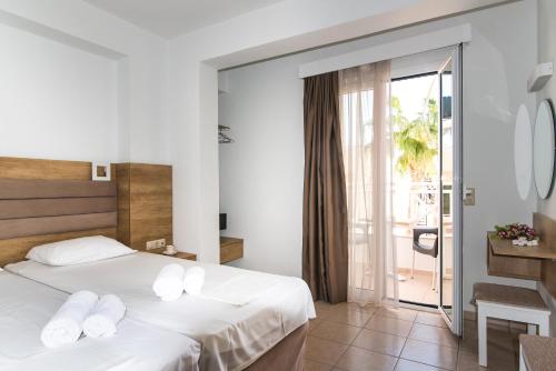 Postel nebo postele na pokoji v ubytování Vagelis Apartments Malia