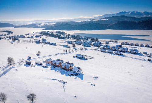 an aerial view of a village in the snow at Chata Stylchyn in Kluszkowce