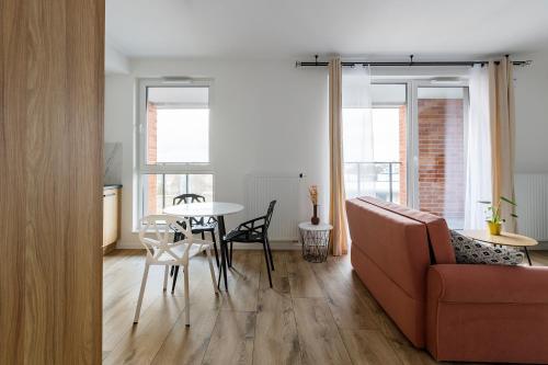 a living room with a couch and a table at Homewell Apartments Goplana in Poznań