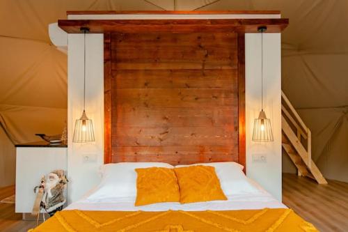 a bedroom with a bed and a dresser at Refúgio das Poldras in Mondim de Basto