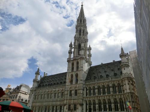 a large building with a tower on top of it at Hotel Aviation in Brussels