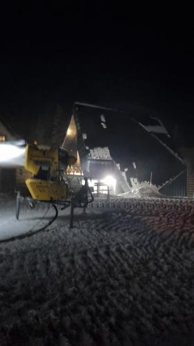 a helicopter parked in front of a building at night at Casa Valley Paradiso - Jahorina in Jahorina