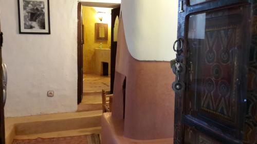 an entrance to a hallway with a door and stairs at Riad Cascades d'Ouzoud in Ouzoud