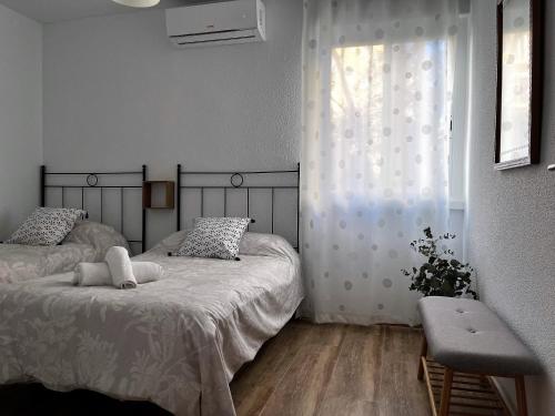 Llit o llits en una habitació de Apartamento Córdoba Palace