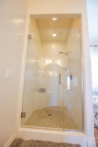 a shower with a glass door in a bathroom at 3400 SqFt House W/40Ft Heated Pool/Spa- Strip View in Henderson