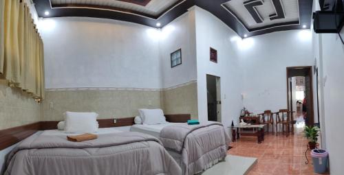 Ένα ή περισσότερα κρεβάτια σε δωμάτιο στο Kana Hasya Homestay "Rumoh Jamee"