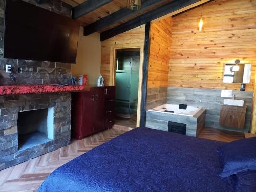 Postel nebo postele na pokoji v ubytování Cabaña Bagheera