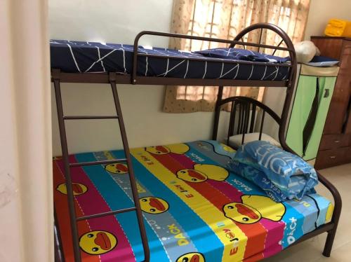 a bunk bed with a hello kitty blanket on it at Homestay Chik Da in Kampong Alor Senjaya