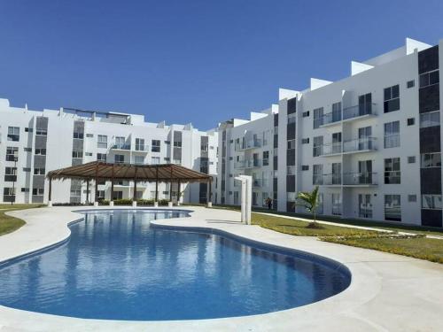a large swimming pool in front of a building at ACAPULCO DIAMANTE!! HERMOSO DEPARTAMENTO NUEVO!! in Acapulco