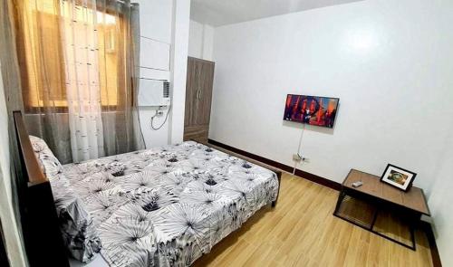 Postel nebo postele na pokoji v ubytování Kaitleen Home Stay Door 2