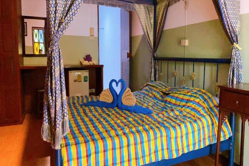Ein Bett oder Betten in einem Zimmer der Unterkunft Viewdoi Art and Resort