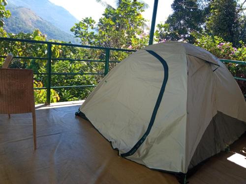 a tent sitting on top of a balcony at Green Valley Vista in Munnar