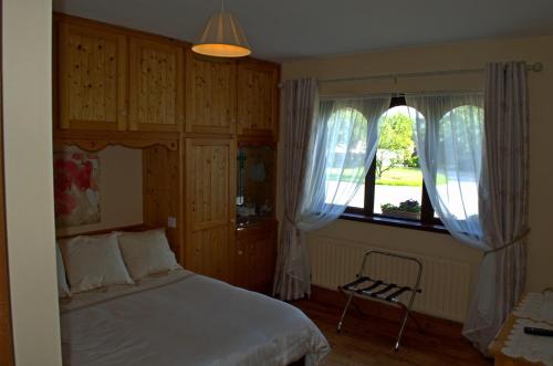 Postel nebo postele na pokoji v ubytování Old Orchard Lodge B&B