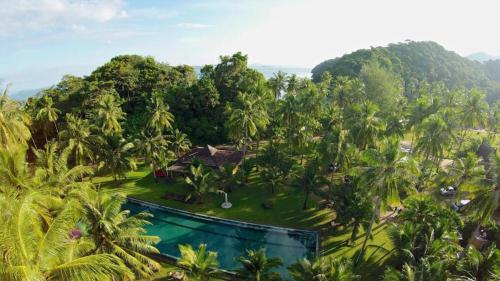 an aerial view of a resort with palm trees at Siam Royal View Pool Villa in Ko Chang