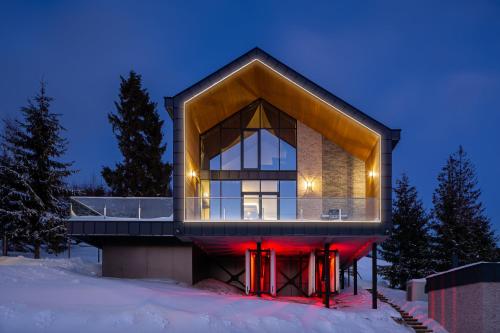 a house in the snow at night at Villas Fomich in Bukovel