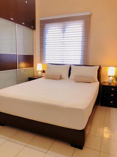 Cama o camas de una habitación en 101 Sky Mirror Homestay