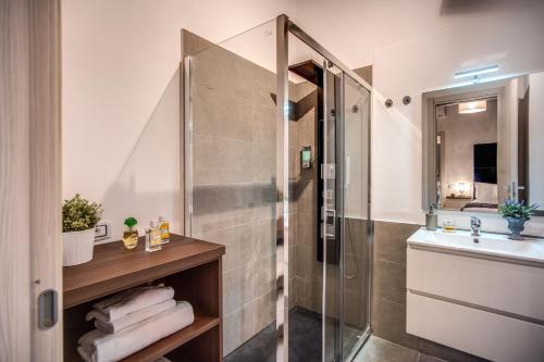 a bathroom with a shower and a sink at Tritone Top House in Rome