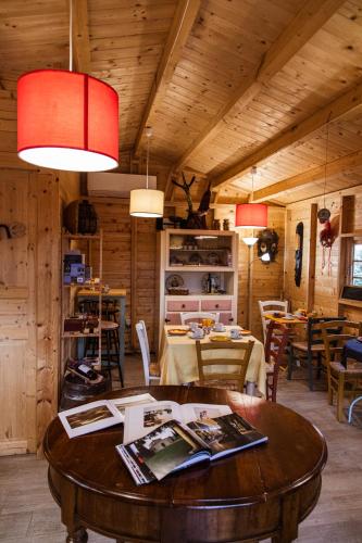 a dining room with a table and some chairs at Poggio del Sole in Castiglione del Lago