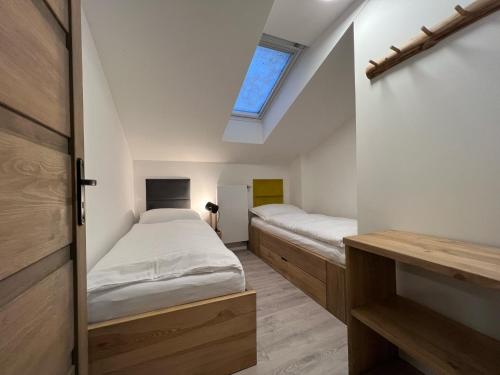 Postel nebo postele na pokoji v ubytování Apartmány Panorama Harrachov
