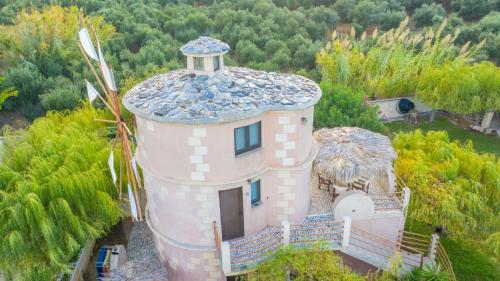 an aerial view of a house with a tower at Anemomili Village in Kissamos