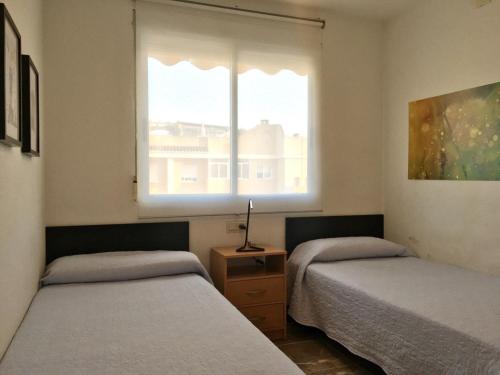 Ένα ή περισσότερα κρεβάτια σε δωμάτιο στο Xaloc Solo Familias Serviplaya