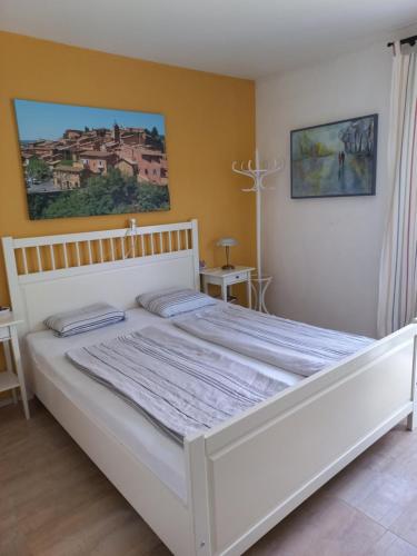 Ένα ή περισσότερα κρεβάτια σε δωμάτιο στο Haus mit mediterranem Flair