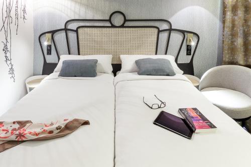 Postel nebo postele na pokoji v ubytování Mercure Orléans Portes de Sologne