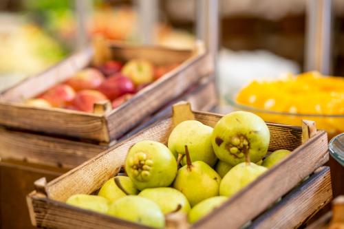 a bunch of baskets filled with apples and other fruit at Erboy Hotel Istanbul Sirkeci in Istanbul