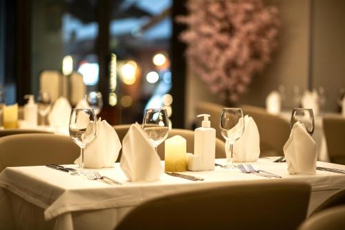a table in a restaurant with glasses and napkins at Erboy Hotel Istanbul Sirkeci in Istanbul
