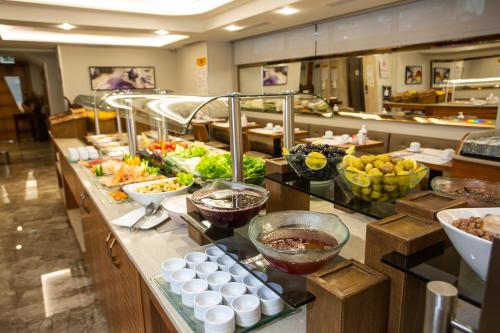 a buffet line with many different types of food at Erboy Hotel Istanbul Sirkeci in Istanbul