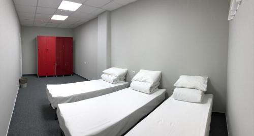 Postel nebo postele na pokoji v ubytování Hostel City Center