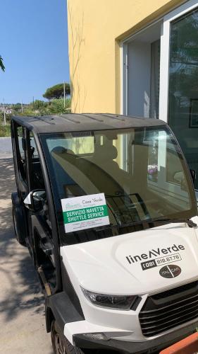 a white car parked in front of a building at Pensione Casa Verde in Ischia