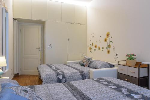 Posteľ alebo postele v izbe v ubytovaní Monnalisa Apartment tra Pitti e Ponte Vecchio