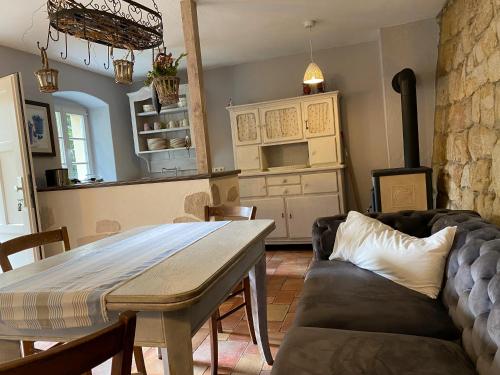 a living room with a table and a couch at Wanderer Paradies in Pirna