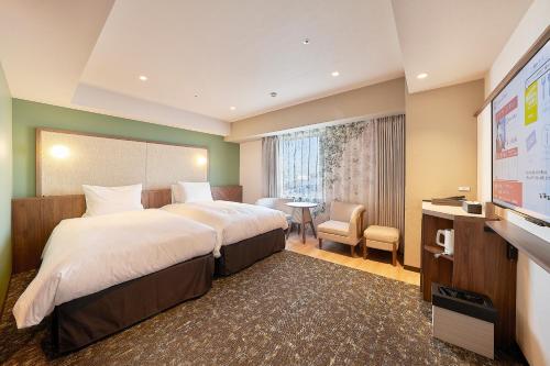 Postel nebo postele na pokoji v ubytování Keisei Richmond Hotel Tokyo Kinshicho