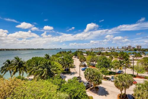 an aerial view of a beach with palm trees at Singer Island Inn/ Deluxe Studio in West Palm Beach
