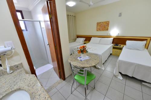 Ένα ή περισσότερα κρεβάτια σε δωμάτιο στο Vind's Plaza Hotel