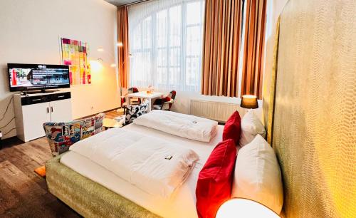 Ένα ή περισσότερα κρεβάτια σε δωμάτιο στο artHOTEL Magdeburg
