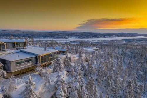 an aerial view of a house in the snow at Lapland View Lodge in Övertorneå