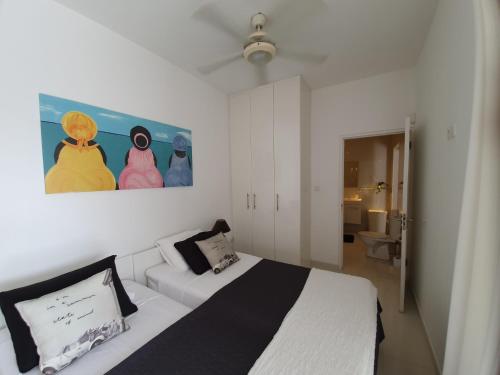 Säng eller sängar i ett rum på C APARTMENT at JAN THIEL Curacao