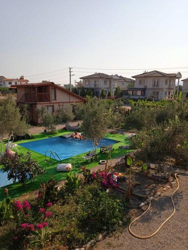 an image of a swimming pool in a yard at Gulseven Bungalow Villas in Dalaman