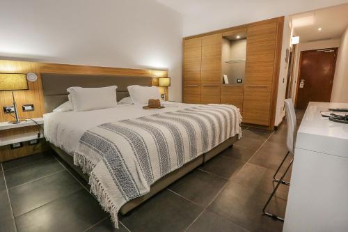 Katil atau katil-katil dalam bilik di Hôtel San Lucianu