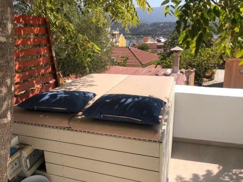 two black pillows sitting on top of a roof at METROPOLIS Argostoli House/villa with garden & pool-jacuzzi in Argostoli