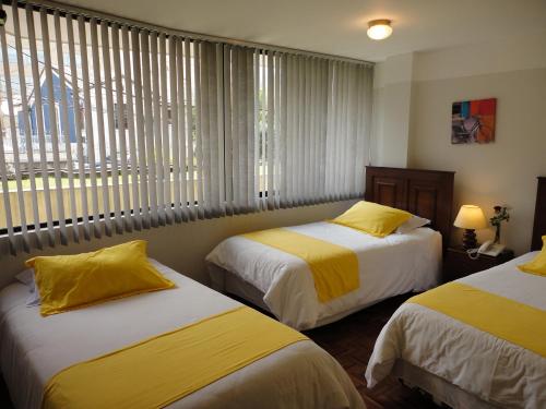 En eller flere senger på et rom på Hotel Rincón Escandinavo