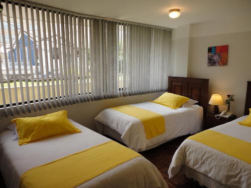 Postel nebo postele na pokoji v ubytování Hotel Rincón Escandinavo