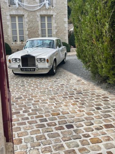 a white car parked in front of a house at Demeure des Vieux Bains in Provins