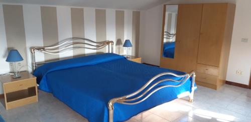 Ein Bett oder Betten in einem Zimmer der Unterkunft Appartamento Cielo